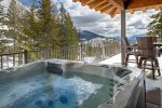 Relax and take in the expansive mountain views from the private hot tub.